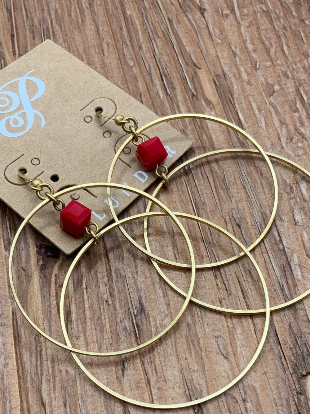 Plunder Design 'Riley" Gold Tone Double Hoop with Red Cube Accent Earrings